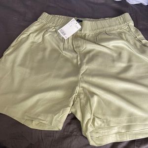 Flared olive green shorts